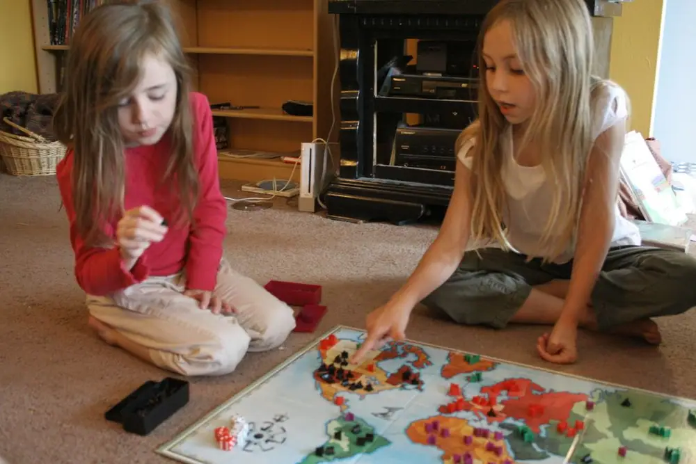 My six and nine year old play their first game of Risk.