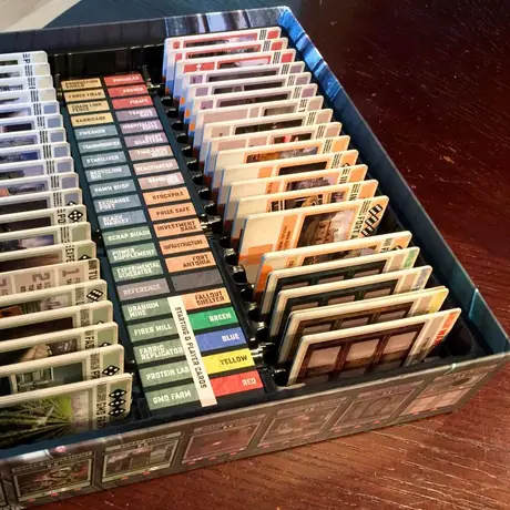 First look at the production box for Colony. The insert works for cards that are both sleeved and unsleeved. The center area hides compartments for the dice and tokens.