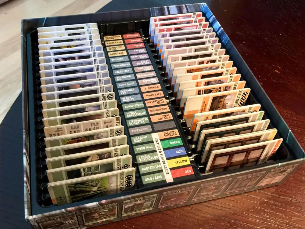First look at the production box for Colony. The insert works for cards that are both sleeved and unsleeved. The center area hides compartments for the dice and tokens.