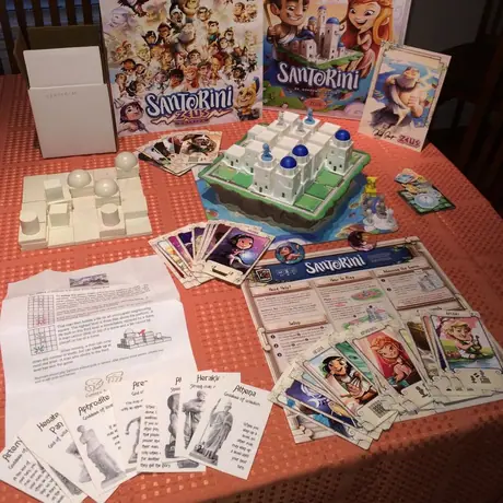 Santorini Deluxe edition of 2016-2017 (Zeus) side by side with the "deluxe" edition of 2007. A beautiful game, now with divine components.