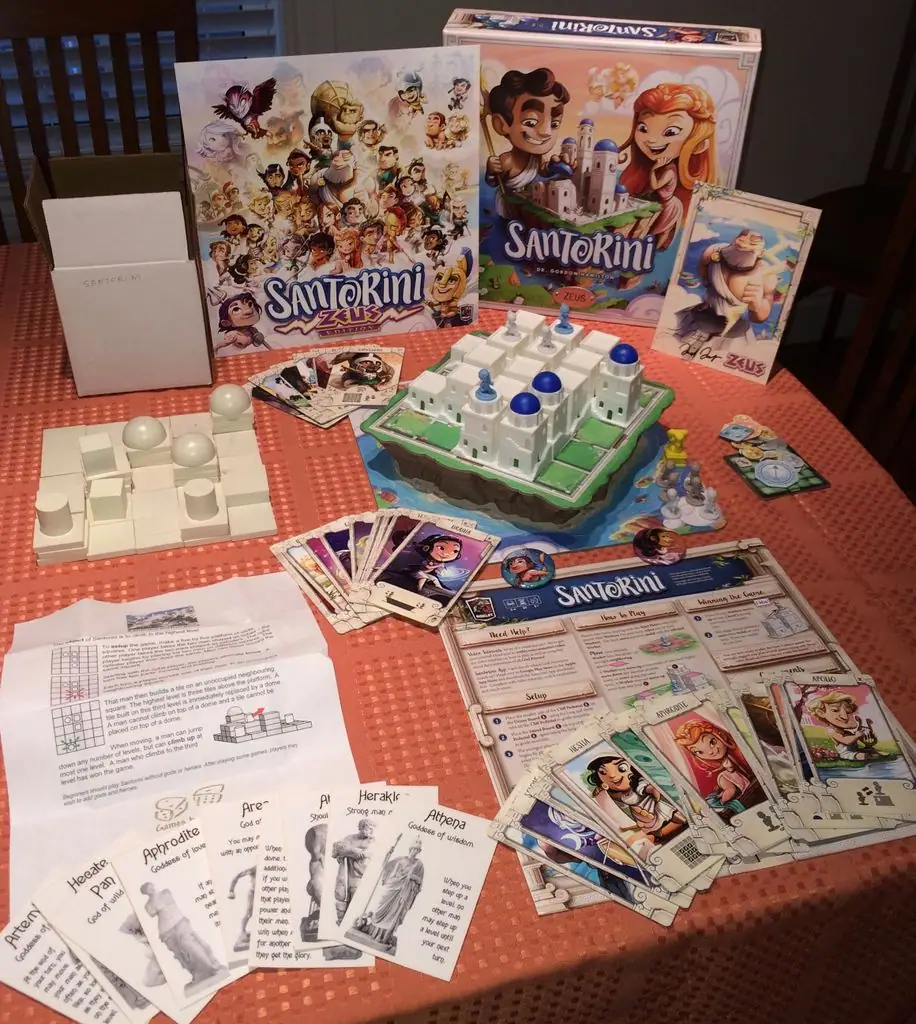 Santorini Deluxe edition of 2016-2017 (Zeus) side by side with the "deluxe" edition of 2007. A beautiful game, now with divine components.