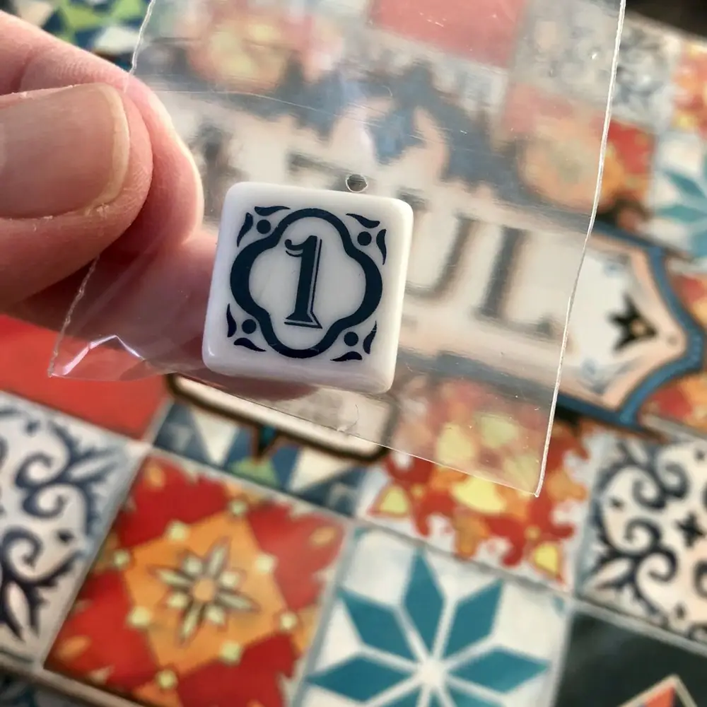 The new first player rasin tile coming with the latest print run of the game