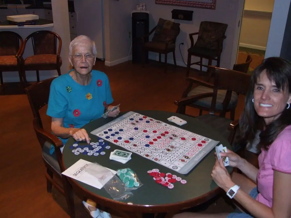 Eunice & Millie enjoying a game at the retirement center