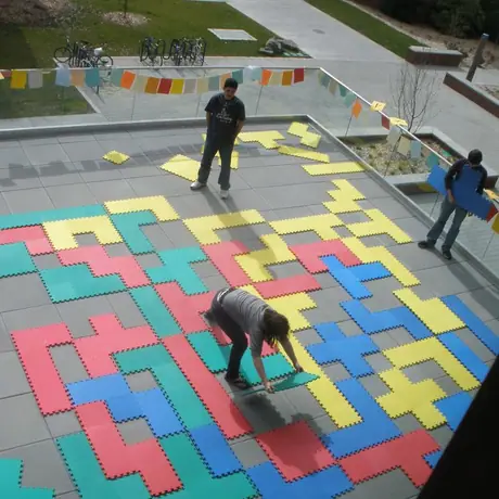 Ginormous blokus, made out of kids' floor mat tiles