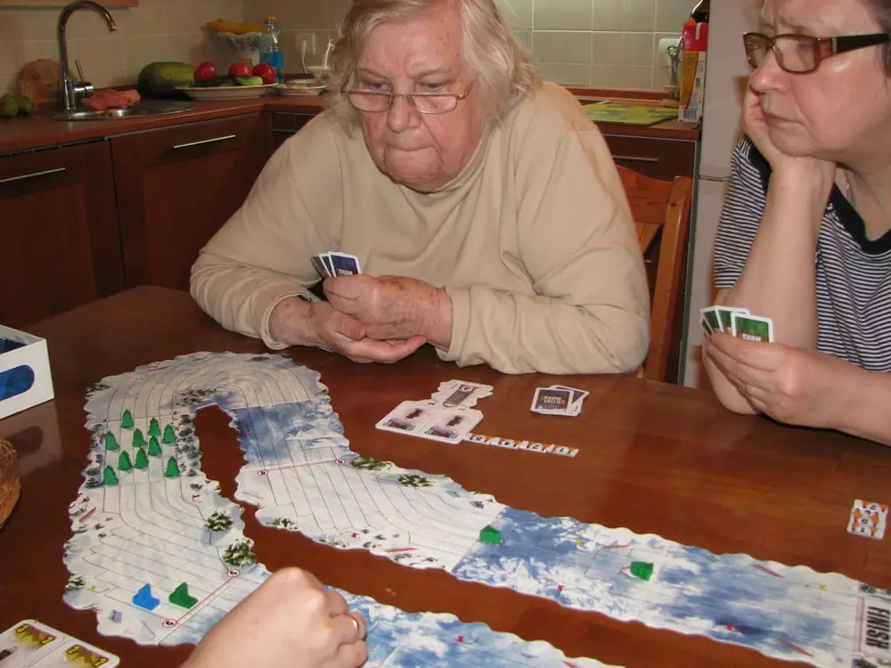 Grandma racing! Her sled is blue.